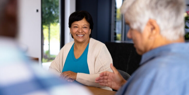 Senior Woman Meeting with Staff at Assisted Living Facility